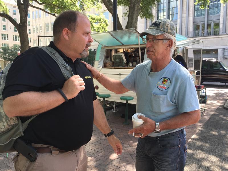 Lou Dougherty (left) talks to one of the veterans who's taken advantage of the services available through Emergency Services and Homeless Coalition of Northeast Florida.